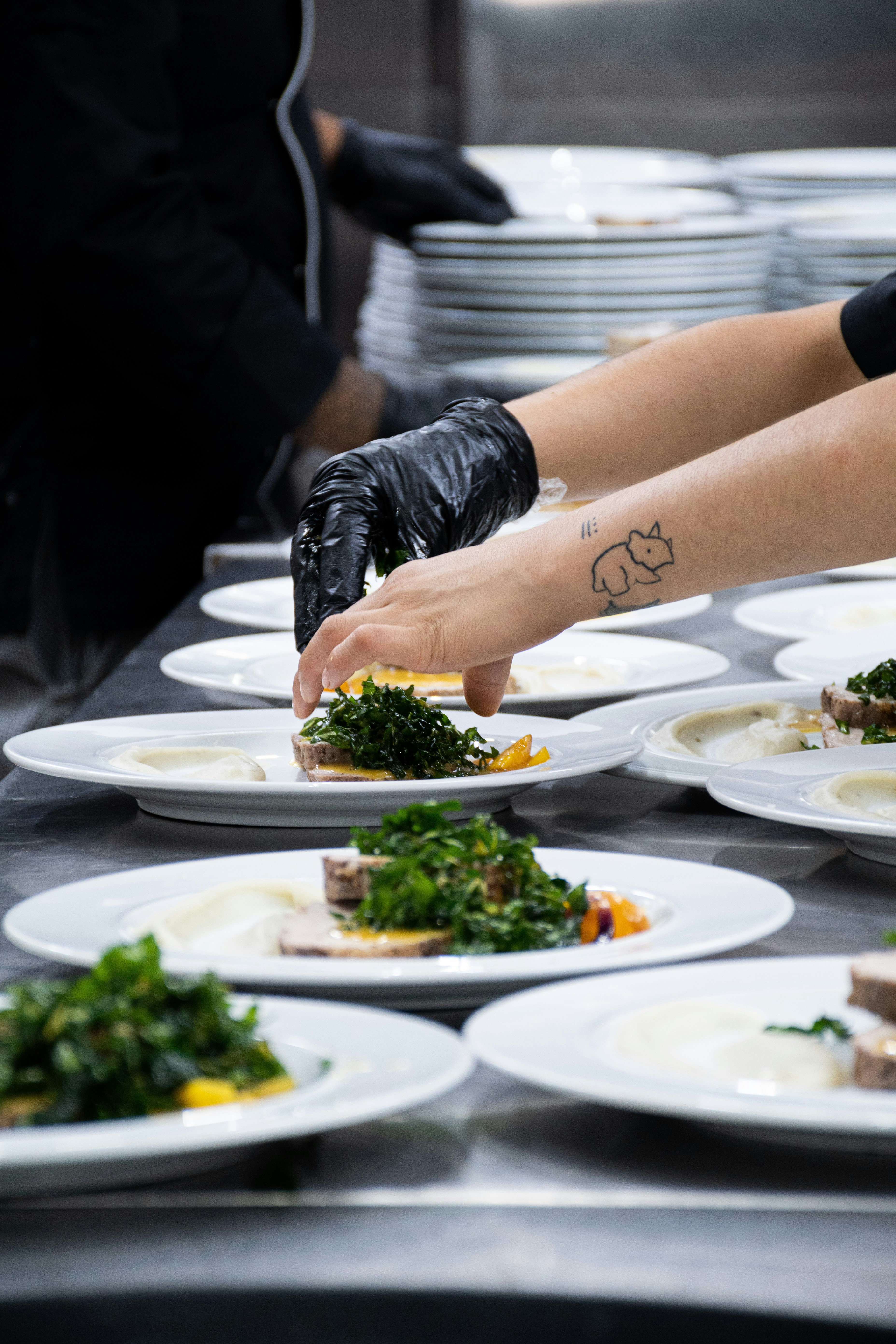 Professional chef plating elegant dishes